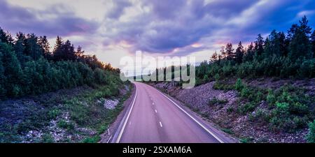 Empty asphalt road in rural landscape at sunset with dramatic sky Stock ...