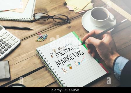 man written digital marketing text on notepad Stock Photo