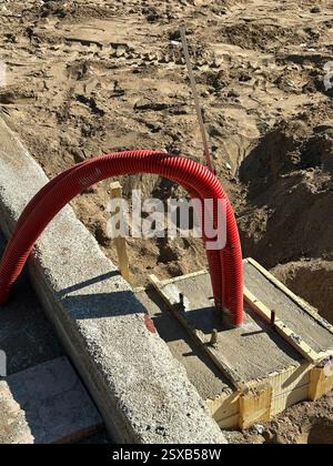 Construction Site with Red Corrugated Electrical Conduit  Stock Photo