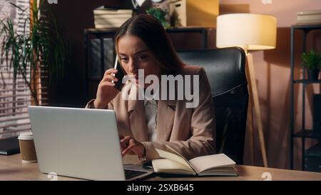 Worried Caucasian business woman female girl businesswoman office worker freelancer entrepreneur negotiating talk mobile phone cellphone call planning Stock Photo