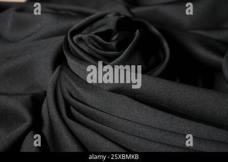 Abstract background texture of black color fabric. Fabric texture of beautiful silk or satin, Luxurious blue, soft and smooth. Ready for cut and sew Stock Photo