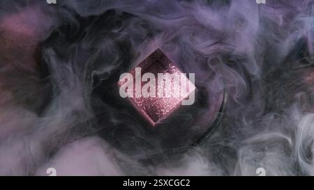 Glittering smoke cube. Paint vapor fume. Purple black purple color flow cloud glowing fluid ink texture fog on dark abstract art background. Stock Photo