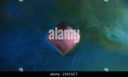 Splash water ink. Glow sparks texture. Blue green multicolor flow smoke paint sparkling glitter purple cube cloud on art shimmer light background. Stock Photo