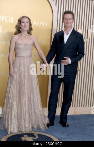 Shauna Robertson, left, and Edward Norton arrive at the Oscars on