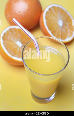 Orange juice in glass and oranges Stock Photo