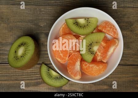 Clementine pieces and kiwi slices in peel Stock Photo