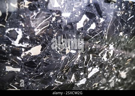 Glossy black marble with striking white accents and reflective abstract patterns, stone, natural stone, stone structure Stock Photo