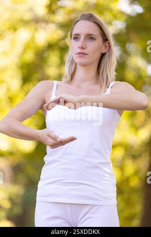 caucasian woman practices thai chi Stock Photo
