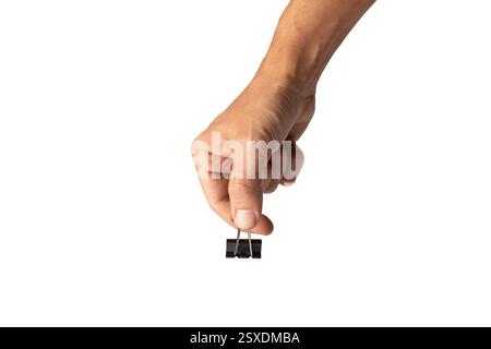 Male hand holding a paper clip or binder isolated no background Stock Photo