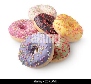Group of donuts decorated with icing of various colors and colorful sprinkles, close up shot, isolated on white background Stock Photo