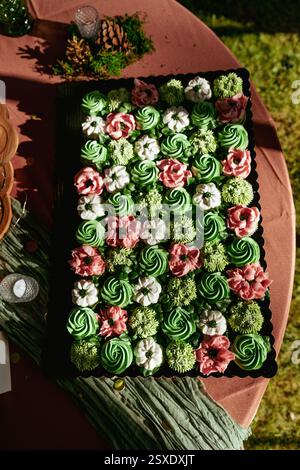 Succulent wedding cupcake display with floral decorations Stock Photo