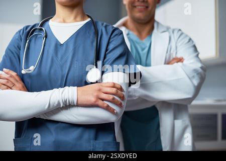 Healthcare Professionals in Uniforms Collaborating at a Clinic Office Stock Photo