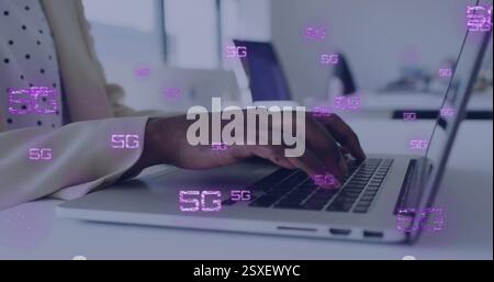 Image of 5g text and data processing over afrcian american businesswoman using laptop Stock Photo