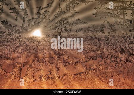 Sunrise through Frosted Window - warm and cool Stock Photo