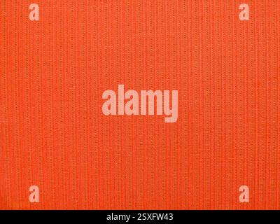 shabby worn old fabric woven from cotton and wool with a striped pattern red-orange color, fragment full frame, piece of furniture upholstery Stock Photo