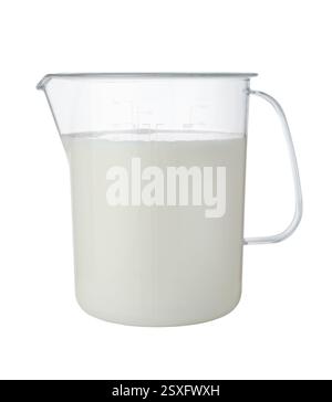 Fresh milk in a large plastic measuring cup isolated on white. Stock Photo