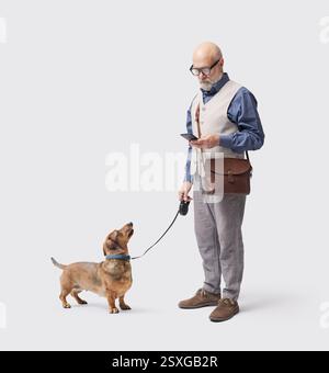 Man walking the dog and checking the smartphone, the dog is staring at him, isolated on white background Stock Photo