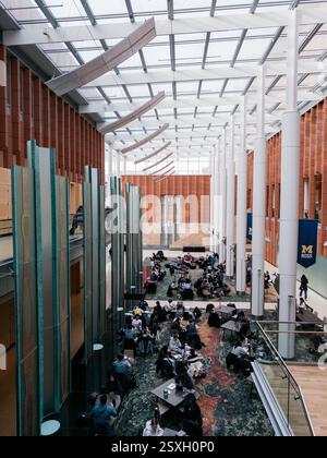 Students studying in the Davidson Winter Garden common area in the Ross School of Business, University of Michigan, Ann Arbor Michigan USA Stock Photo