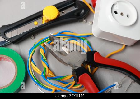 Different electrical tools on grey table, above view Stock Photo