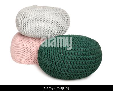 Stylish colorful knitted poufs on white background Stock Photo