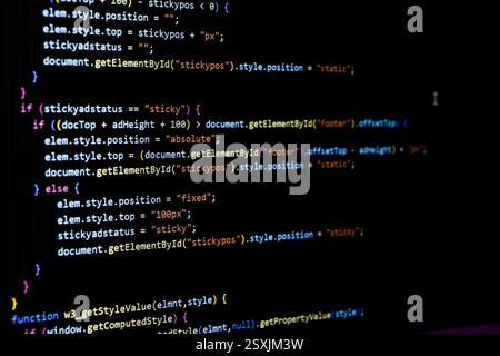 Software source code. Programming code. Programming code on computer screen. Developer working on program codes in office. Source code photo. Technolo Stock Photo