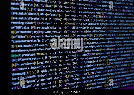 TitleSoftware source code. Programming code. Programming code on computer screen. Developer working on program codes in office. Source code Stock Photo