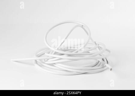 Tangled insulated electrical wire isolated on white Stock Photo