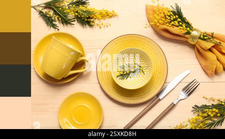 Beautiful table setting with mimosa flowers on wooden background. Different color patterns Stock Photo