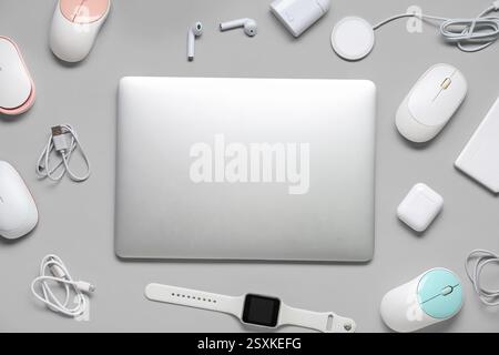 Composition with different modern gadgets on grey background Stock Photo