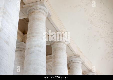 Close up of white travertine marble columns and pillars in Rome, by the Vatican city Stock Photo