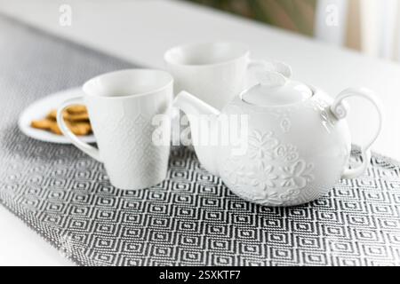 White ceramic tea set with cookies Stock Photo