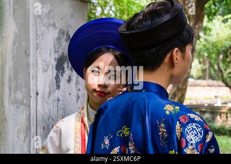 A young couple in traditional dress in the Giam Garden during the celebrations for the 70th anniversary of the liberation of the capital on 10 October Stock Photo