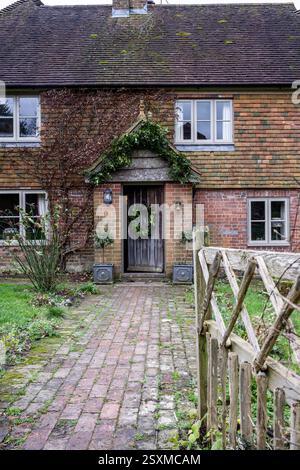 Christmas wreath on front door of East Sussex Tudor farmhouse dating from 1540, England, UK. Stock Photo