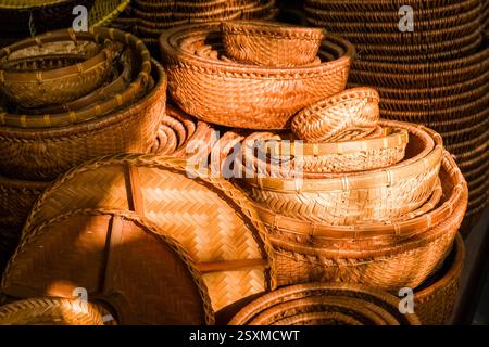 Braided bamboo baskets and bowls are offered for sale in a shop in the historic centre of Hanoi. Stock Photo