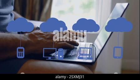 Image of media icons over caucasian man using laptop Stock Photo
