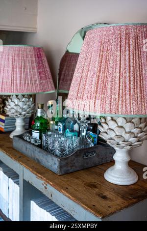 Pair of lamps and drinks tray in Chalford weavers cottage in the Cotswolds, Gloucestershire, England, UK. Stock Photo
