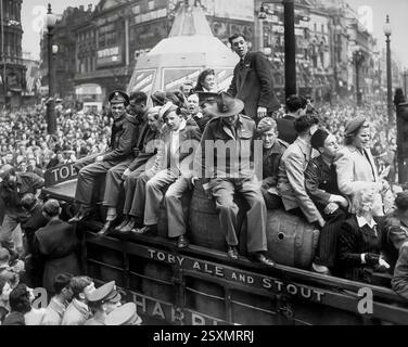 Crowded trucks made their way through London streets during Victory in