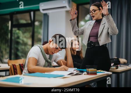 Teacher guiding students during an interactive classroom session Stock Photo