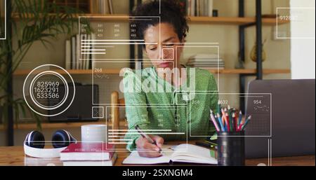 Analyzing data and writing, woman in office with digital interface image Stock Photo