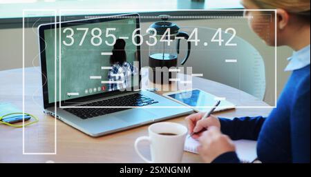 Writing in notebook and holding cup, person attending online class over image of numbers Stock Photo