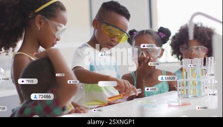 Children conducting science experiments with data and notifications image over them Stock Photo
