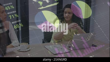 Businesswoman in meeting with charts and graphs image over data analysis Stock Photo
