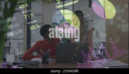 Financial data charts and pie graphs image over business people working in office Stock Photo