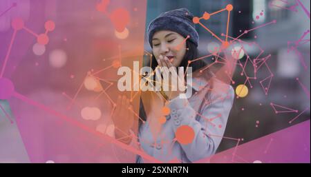 Image of connections over biracial woman using tablet Stock Photo