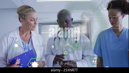 Image of eco icons and data processing over diverse doctors Stock Photo