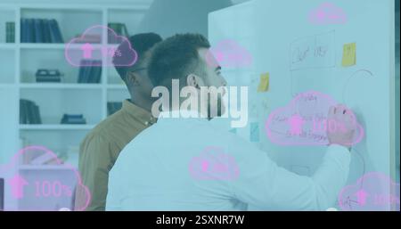 Image of clouds and percent going up over diverse business people in office Stock Photo