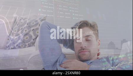 Image of financial data processing over caucasian man sleeping Stock Photo