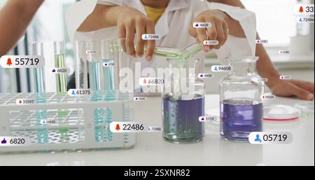 Pouring liquid into beaker, scientist with data processing image over laboratory scene Stock Photo