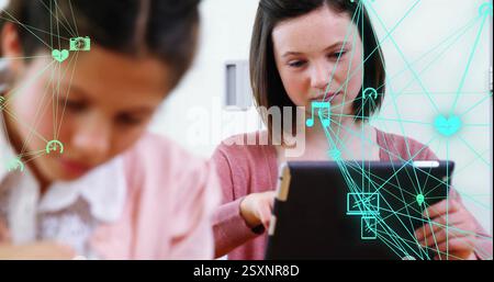 Children using tablets with digital network and data sharing image overlay Stock Photo