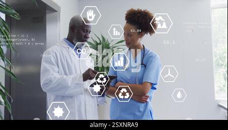 Image of eco icons and data processing over diverse doctors Stock Photo